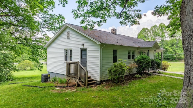 715 Broadway St NW, Lenoir, NC 28645 - rear view of property with a lawn, a chimney, a shingled roof, and central air condition unit