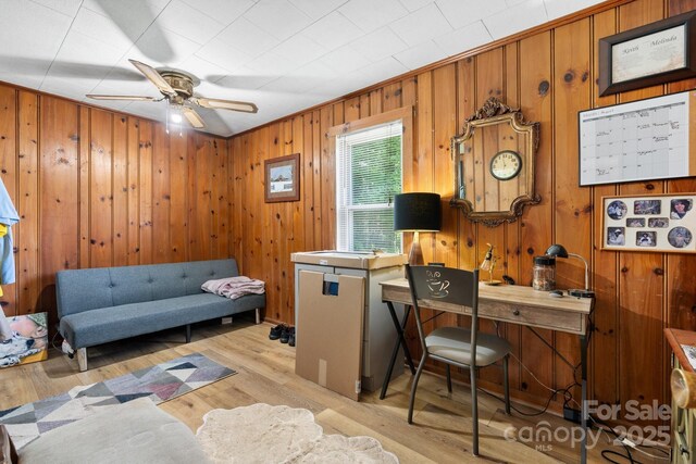715 Broadway St NW, Lenoir, NC 28645 - office with ceiling fan, light wood finished floors, and wooden walls