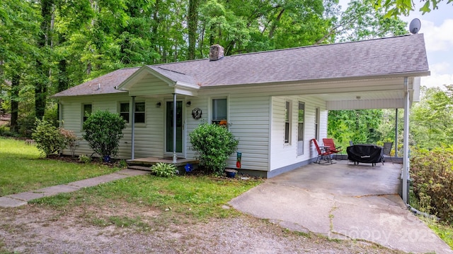 715 Broadway St NW, Lenoir, NC 28645 - ranch-style home with a chimney, roof with shingles, and a front lawn
