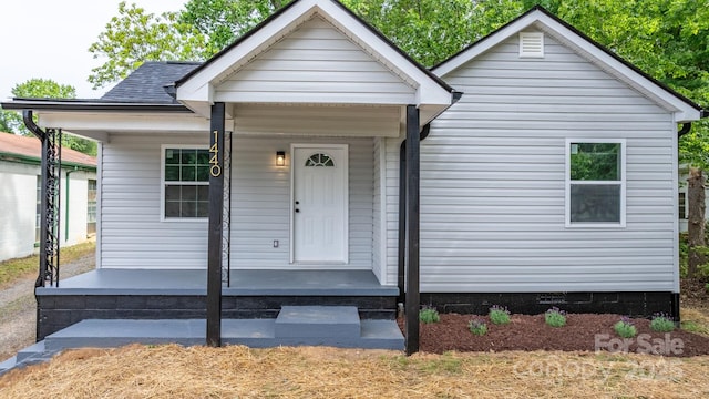 view of front facade featuring covered porch and crawl space