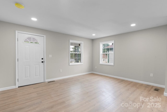 entrance foyer featuring light wood-type flooring, baseboards, and recessed lighting