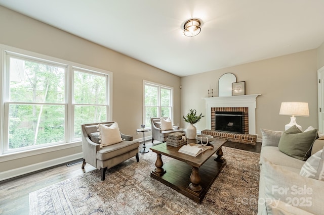 2907 Notchview Ct, Charlotte, NC 28210 - living area featuring wood finished floors, baseboards, and a fireplace