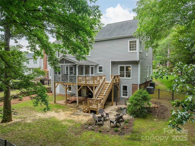 2907 Notchview Ct, Charlotte, NC 28210 - rear view of house featuring stairs, a wooden deck, a sunroom, an outdoor fire pit, and central AC