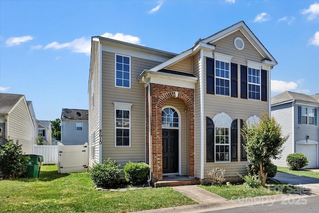 8610 Sawleaf Ct, Charlotte, NC 28215 - traditional-style home with a gate and brick siding