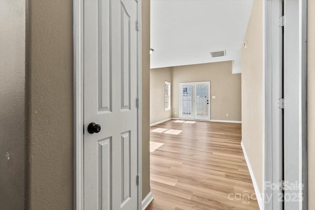 8610 Sawleaf Ct, Charlotte, NC 28215 - corridor with light wood-style flooring and baseboards