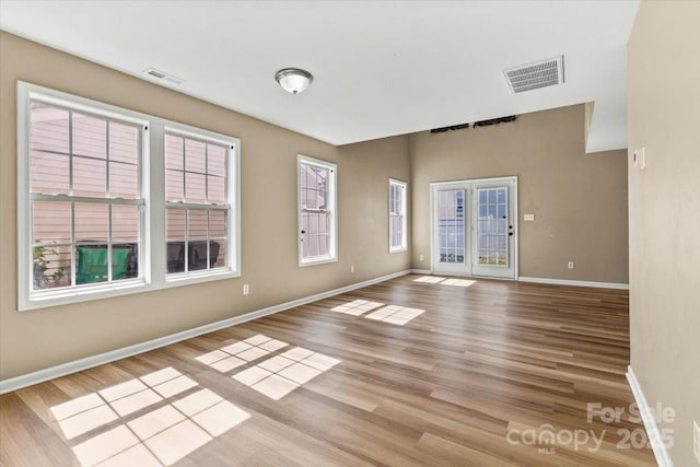 8610 Sawleaf Ct, Charlotte, NC 28215 - spare room featuring baseboards and light wood-style floors