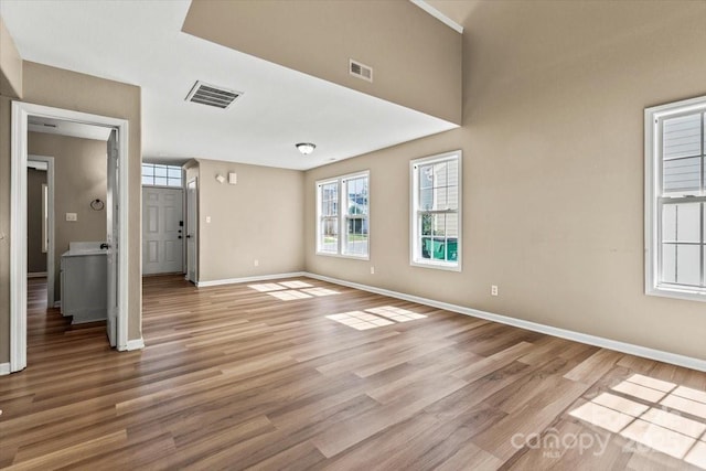 8610 Sawleaf Ct, Charlotte, NC 28215 - empty room featuring baseboards and light wood finished floors