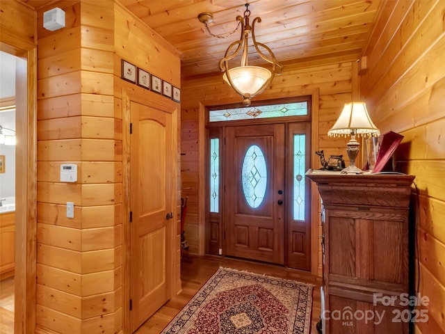 421 Ramp Patch Ln, Waynesville, NC 28786 - foyer featuring light wood-type flooring, wood ceiling, and wood walls