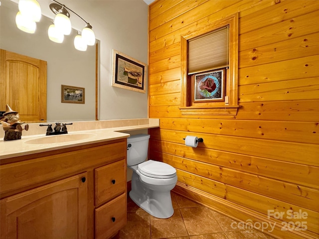 421 Ramp Patch Ln, Waynesville, NC 28786 - bathroom featuring toilet, tile patterned floors, wooden walls, and vanity