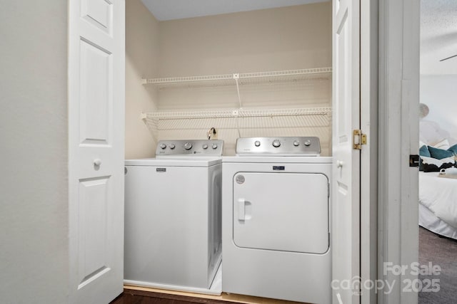 laundry area with independent washer and dryer