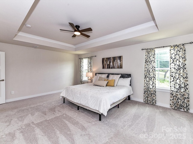 3023 Ballester Rd, Fort Mill, SC 29707 - carpeted bedroom featuring a raised ceiling, baseboards, and ceiling fan