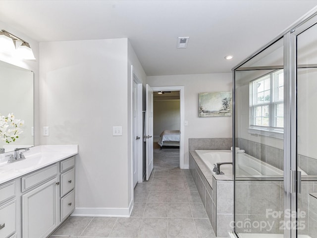 3023 Ballester Rd, Fort Mill, SC 29707 - ensuite bathroom featuring vanity, tile patterned floors, a garden tub, baseboards, and recessed lighting