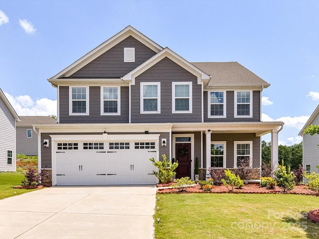 3023 Ballester Rd, Fort Mill, SC 29707 - craftsman-style house with driveway, a front yard, a garage, and a porch