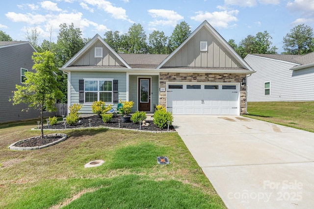 craftsman house with board and batten siding, driveway, an attached garage, and a front lawn