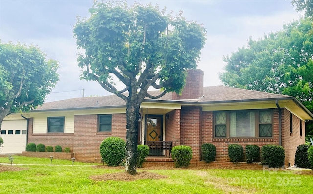 2135 Enon Rd, Morganton, NC 28655 - single story home with brick siding, a front yard, a chimney, and an attached garage