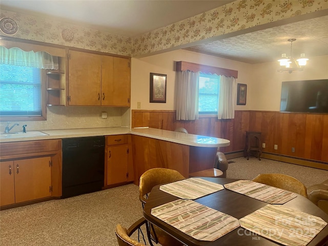 2135 Enon Rd, Morganton, NC 28655 - kitchen featuring black dishwasher, a wainscoted wall, a sink, light countertops, and a chandelier