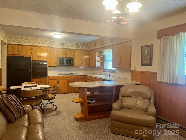 2135 Enon Rd, Morganton, NC 28655 - kitchen with black appliances, light countertops, a chandelier, a peninsula, and open shelves