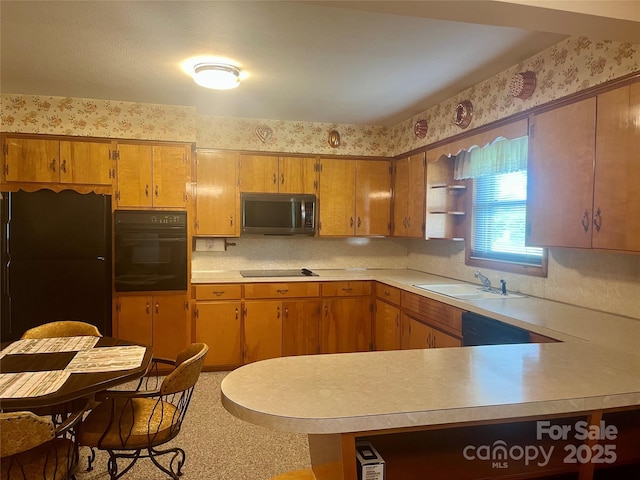 2135 Enon Rd, Morganton, NC 28655 - kitchen featuring black appliances, wallpapered walls, light countertops, open shelves, and a sink