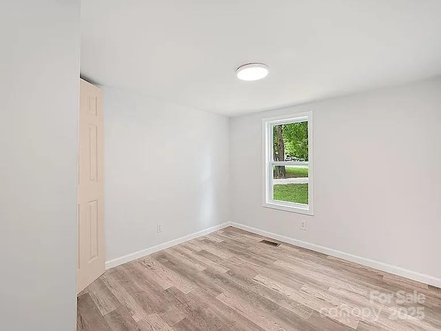 10379 Turnplow Dr, Davidson, NC 28036 - spare room featuring wood finished floors and baseboards
