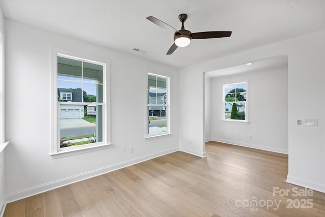 13618 Tranquil Day Dr, Matthews, NC 28105 - unfurnished room featuring light wood finished floors, a ceiling fan, and baseboards