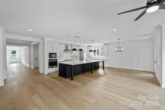 13618 Tranquil Day Dr, Matthews, NC 28105 - kitchen with wall chimney exhaust hood, oven, black microwave, a sink, and light countertops