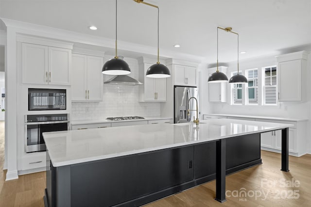 13618 Tranquil Day Dr, Matthews, NC 28105 - kitchen with appliances with stainless steel finishes, decorative backsplash, white cabinetry, a large island, and recessed lighting