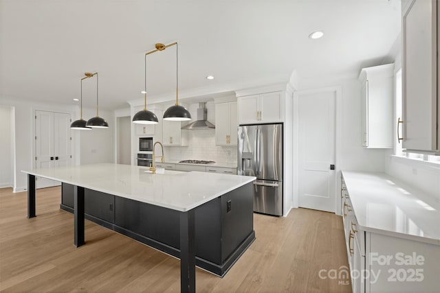 13618 Tranquil Day Dr, Matthews, NC 28105 - kitchen with stainless steel appliances, a sink, wall chimney range hood, white cabinetry, and decorative backsplash