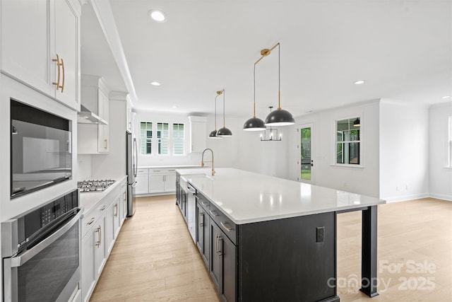 13618 Tranquil Day Dr, Matthews, NC 28105 - kitchen with stainless steel appliances, light wood finished floors, light countertops, white cabinets, and recessed lighting