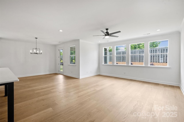 13618 Tranquil Day Dr, Matthews, NC 28105 - unfurnished living room featuring a ceiling fan, light wood-style floors, recessed lighting, a chandelier, and baseboards