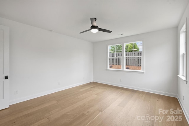13618 Tranquil Day Dr, Matthews, NC 28105 - empty room with light wood-type flooring, ceiling fan, and baseboards