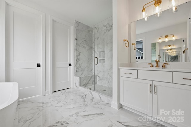 13618 Tranquil Day Dr, Matthews, NC 28105 - bathroom featuring marble look tile flooring, a marble finish shower, a freestanding tub, and vanity