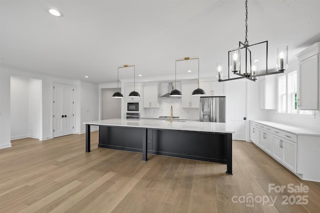 13618 Tranquil Day Dr, Matthews, NC 28105 - kitchen with stainless steel refrigerator with ice dispenser, recessed lighting, backsplash, light wood-style floors, and white cabinets