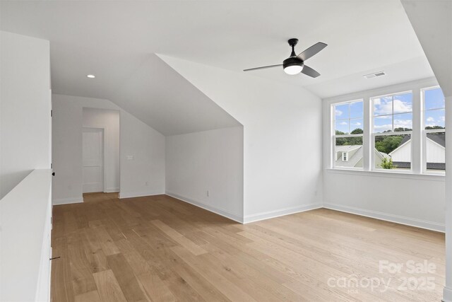 13618 Tranquil Day Dr, Matthews, NC 28105 - additional living space featuring vaulted ceiling, light wood-style floors, a ceiling fan, and baseboards