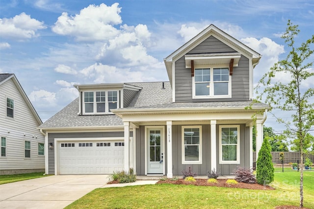 13618 Tranquil Day Dr, Matthews, NC 28105 - view of front of house featuring roof with shingles, covered porch, driveway, and board and batten siding