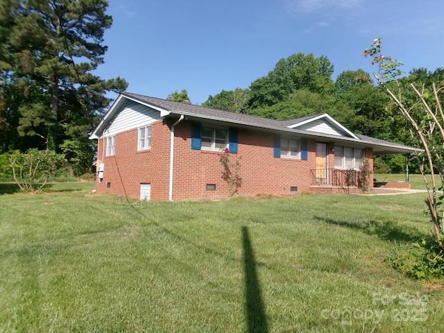 2583 Robinson Rd, Newton, NC 28658 - view of home's exterior featuring crawl space, a yard, brick siding, and a carport
