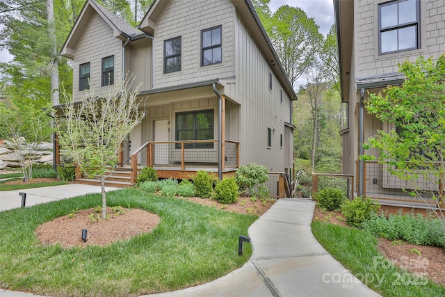 1077 Hicks Rd Unit B, Highlands, NC 28741 - view of front of house with covered porch and board and batten siding