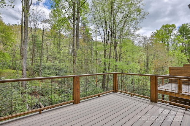 1077 Hicks Rd Unit B, Highlands, NC 28741 - wooden terrace featuring a forest view