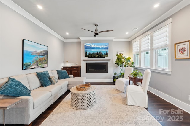 7908 Rea View Ct, Charlotte, NC 28226 - living room with dark wood-style flooring, ceiling fan, a fireplace, baseboards, and ornamental molding