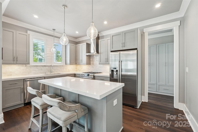 7908 Rea View Ct, Charlotte, NC 28226 - kitchen with stainless steel appliances, gray cabinets, wall chimney range hood, a center island, and decorative backsplash