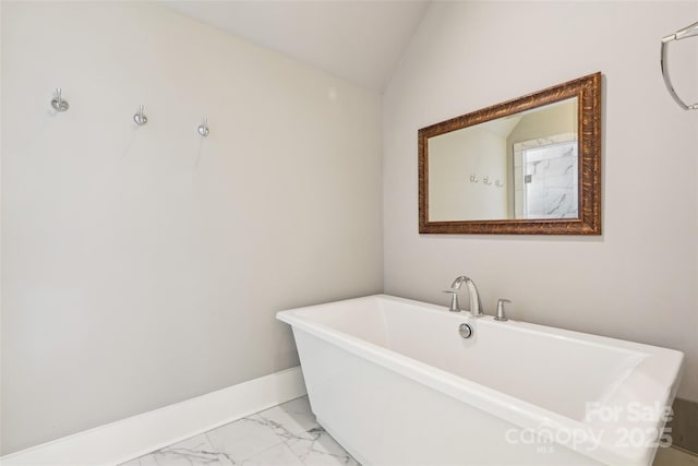 7908 Rea View Ct, Charlotte, NC 28226 - full bathroom with marble finish flooring, vaulted ceiling, a freestanding tub, and baseboards