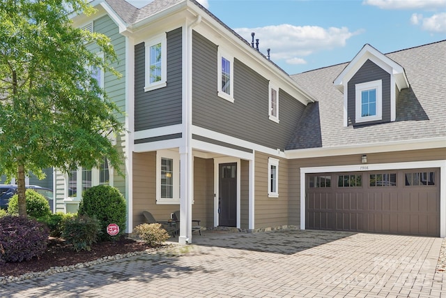 7908 Rea View Ct, Charlotte, NC 28226 - view of front of property with an attached garage, a shingled roof, and decorative driveway