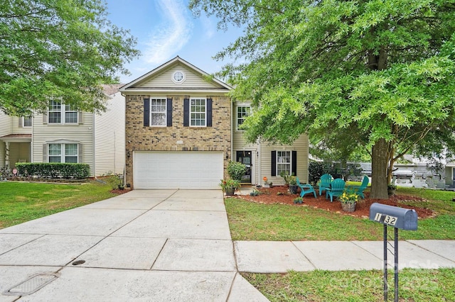 1332 Waterlily Ln, Charlotte, NC 28262 - traditional home with concrete driveway, a garage, a front yard, and brick siding