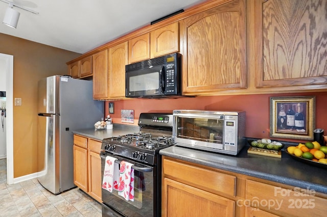 1332 Waterlily Ln, Charlotte, NC 28262 - kitchen featuring black appliances, baseboards, and dark countertops
