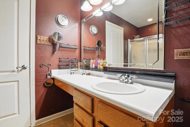 1332 Waterlily Ln, Charlotte, NC 28262 - full bathroom with tile patterned floors, vanity, a textured wall, and a shower with door