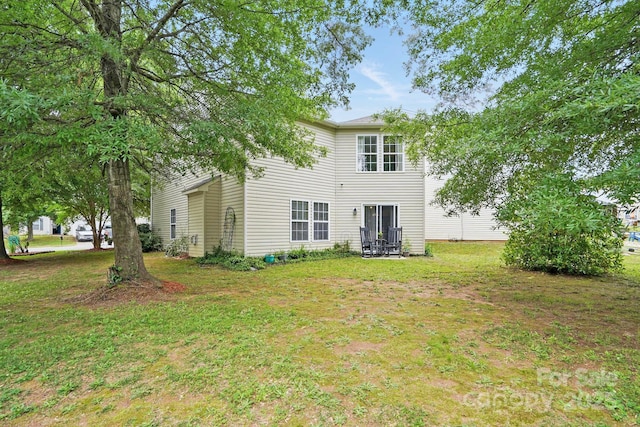 1332 Waterlily Ln, Charlotte, NC 28262 - rear view of property featuring a lawn