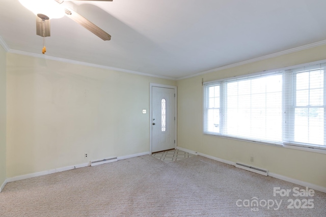 unfurnished room featuring a baseboard heating unit, a baseboard radiator, crown molding, carpet floors, and baseboards