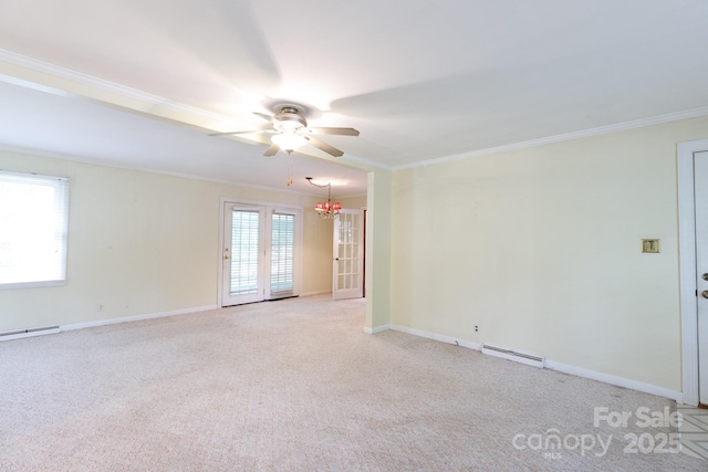 unfurnished room featuring crown molding, a baseboard heating unit, a ceiling fan, light carpet, and a chandelier
