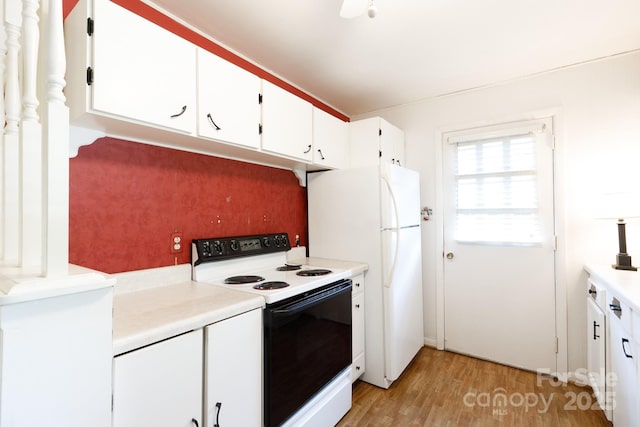 kitchen featuring white appliances, light wood-type flooring, white cabinets, and light countertops