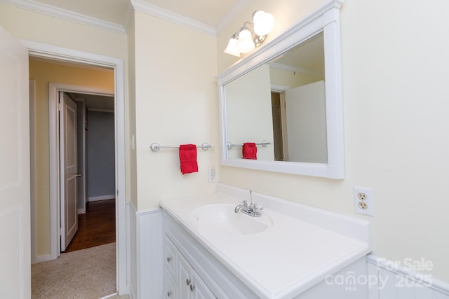 bathroom with vanity and ornamental molding
