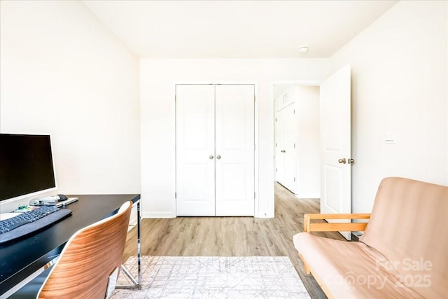 office area featuring wood finished floors and baseboards